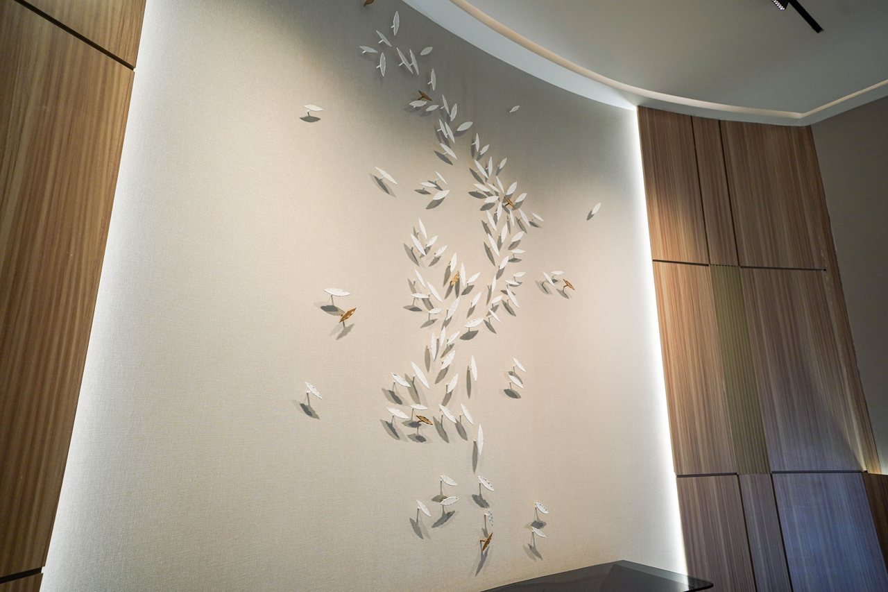 Leaf relief panel against timber wall cladding on a Business Square landing