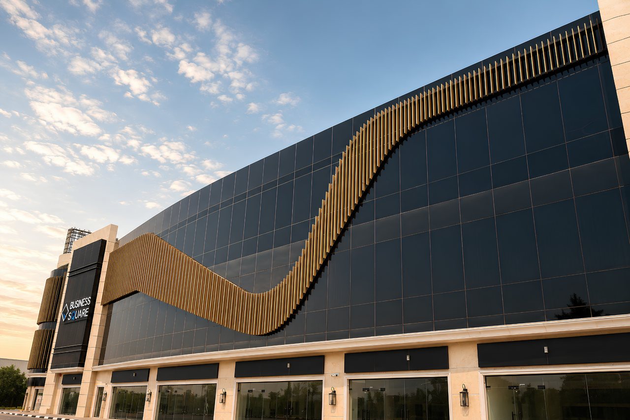 Close view of the signature bronze wave that sweeps across the upper floors of Business Square