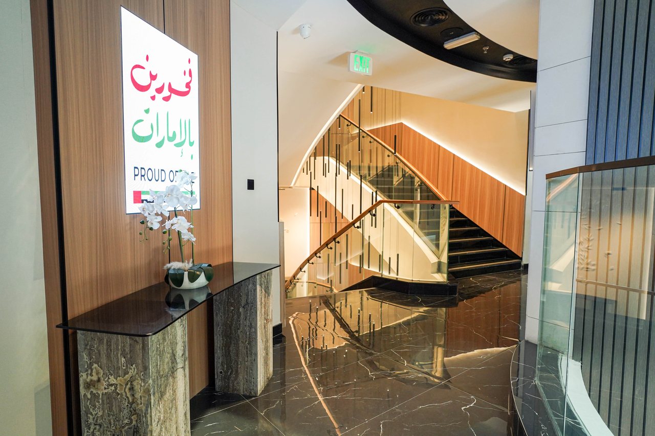 Console table and floor lobby detail beside the atrium on an office level