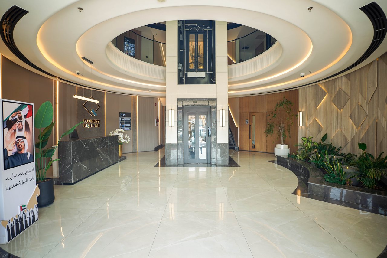 The grand entrance hall of Business Square with its elliptical ceiling and polished floor