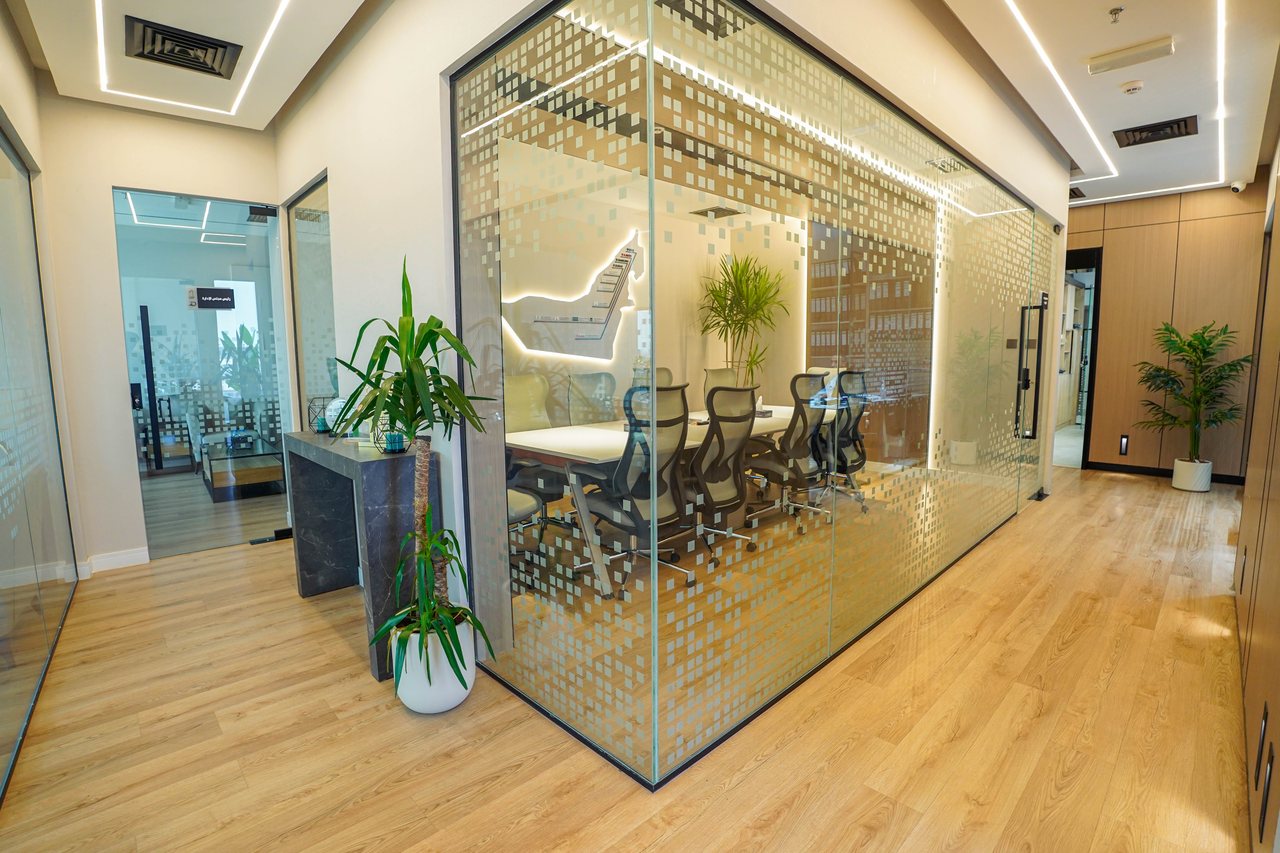 Glazed meeting room within an open-plan Business Square office