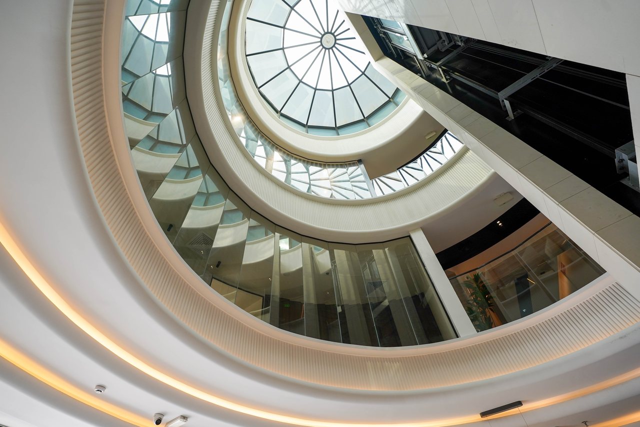 The spiral staircase seen from above beneath the glazed dome